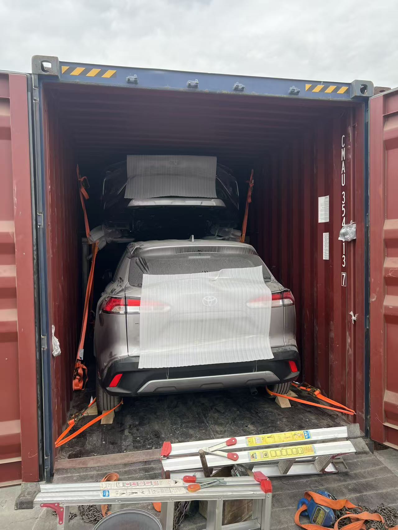 Protected vehicle secured inside red container