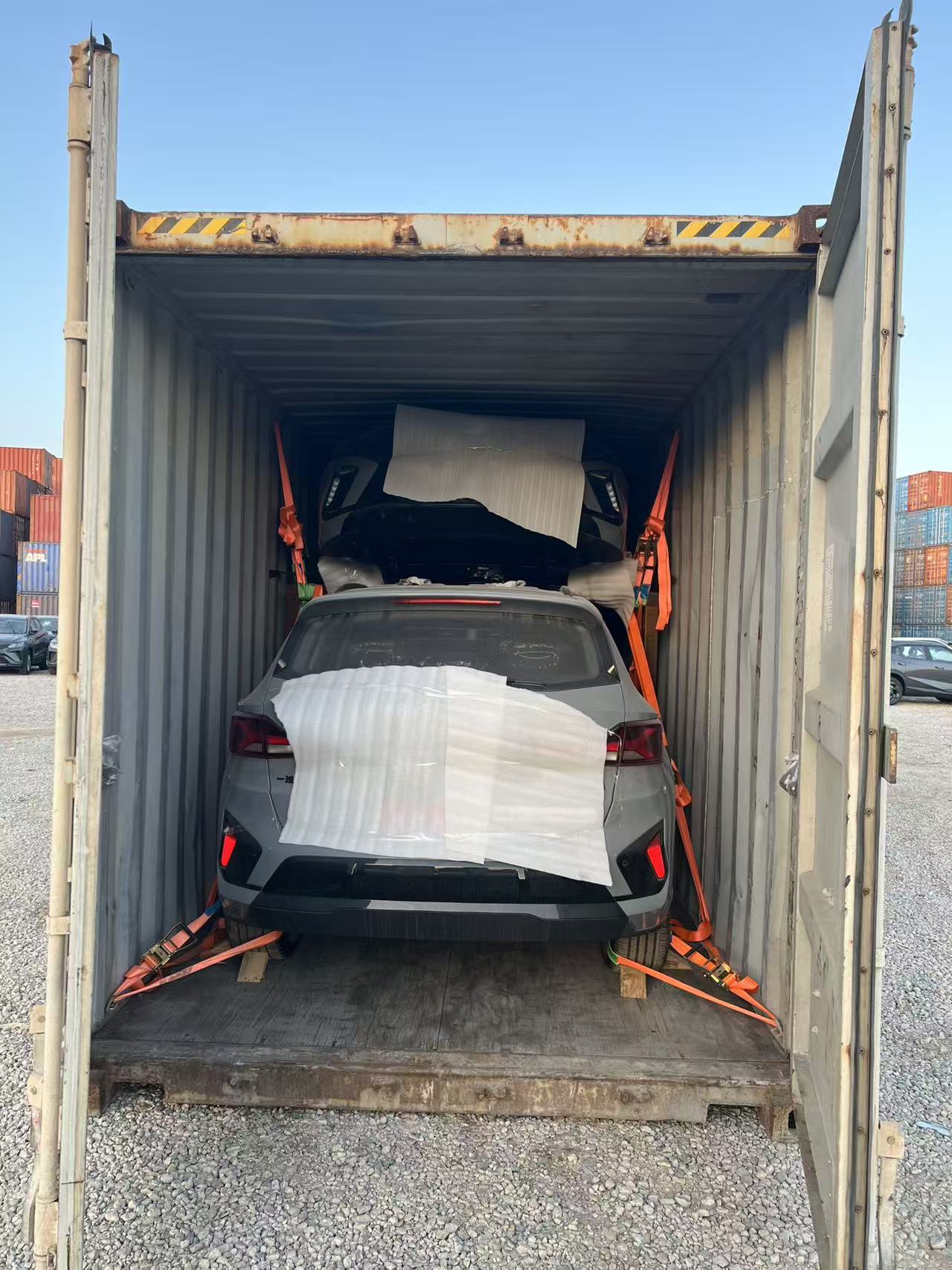 Vehicle secured inside container from rear view
